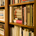 Book shelves, stacked with books